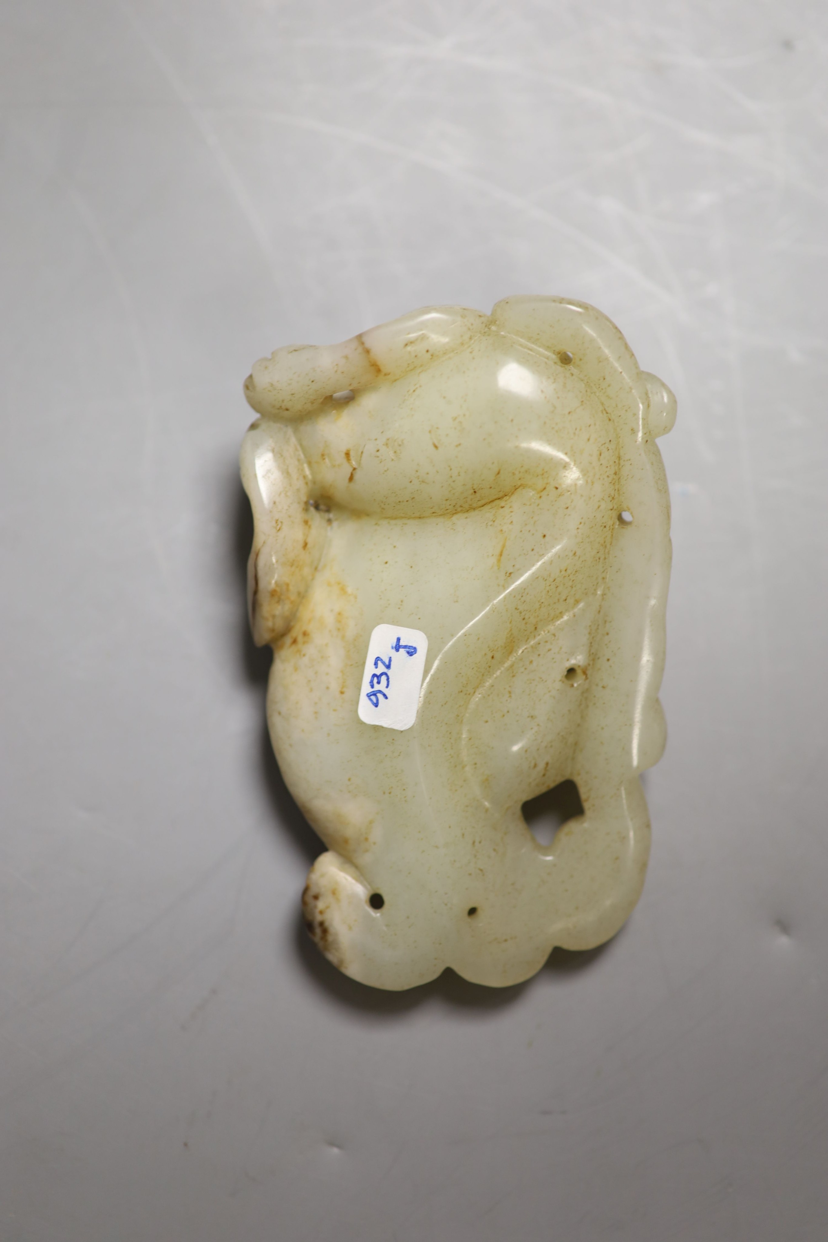 A Chinese pale celadon jade figure of a pixin, 11cm wide